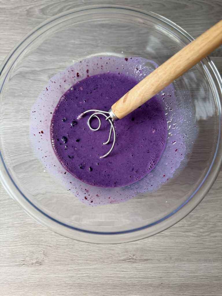 mixing blueberry English muffins