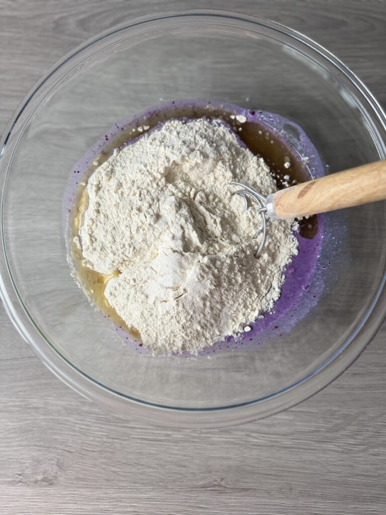 mixing blueberry English muffins