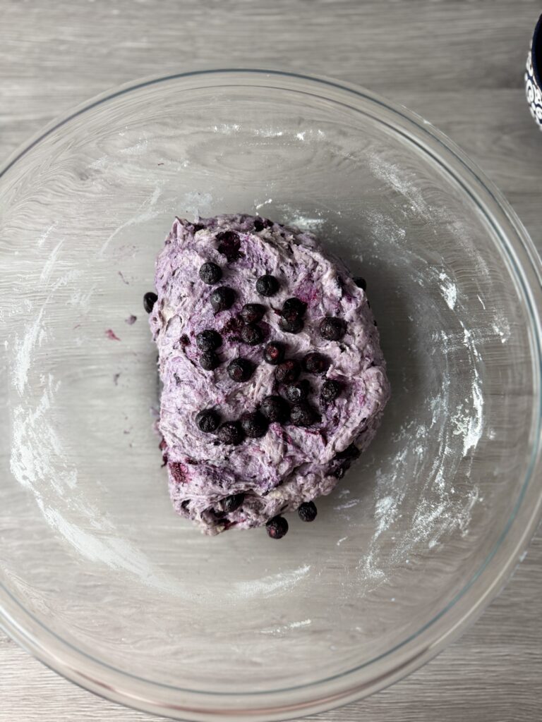 adding bluberries to English muffins