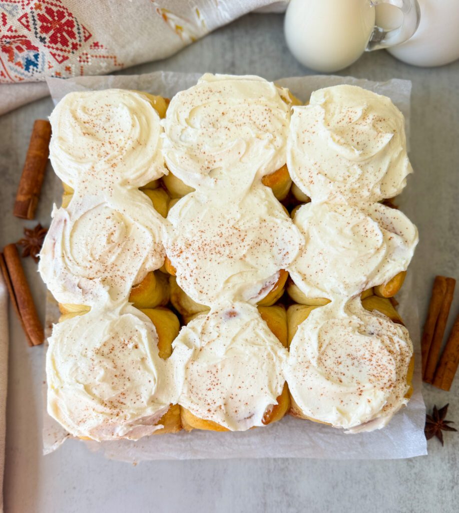 frosting the sourdough discard cinnamon rolls
