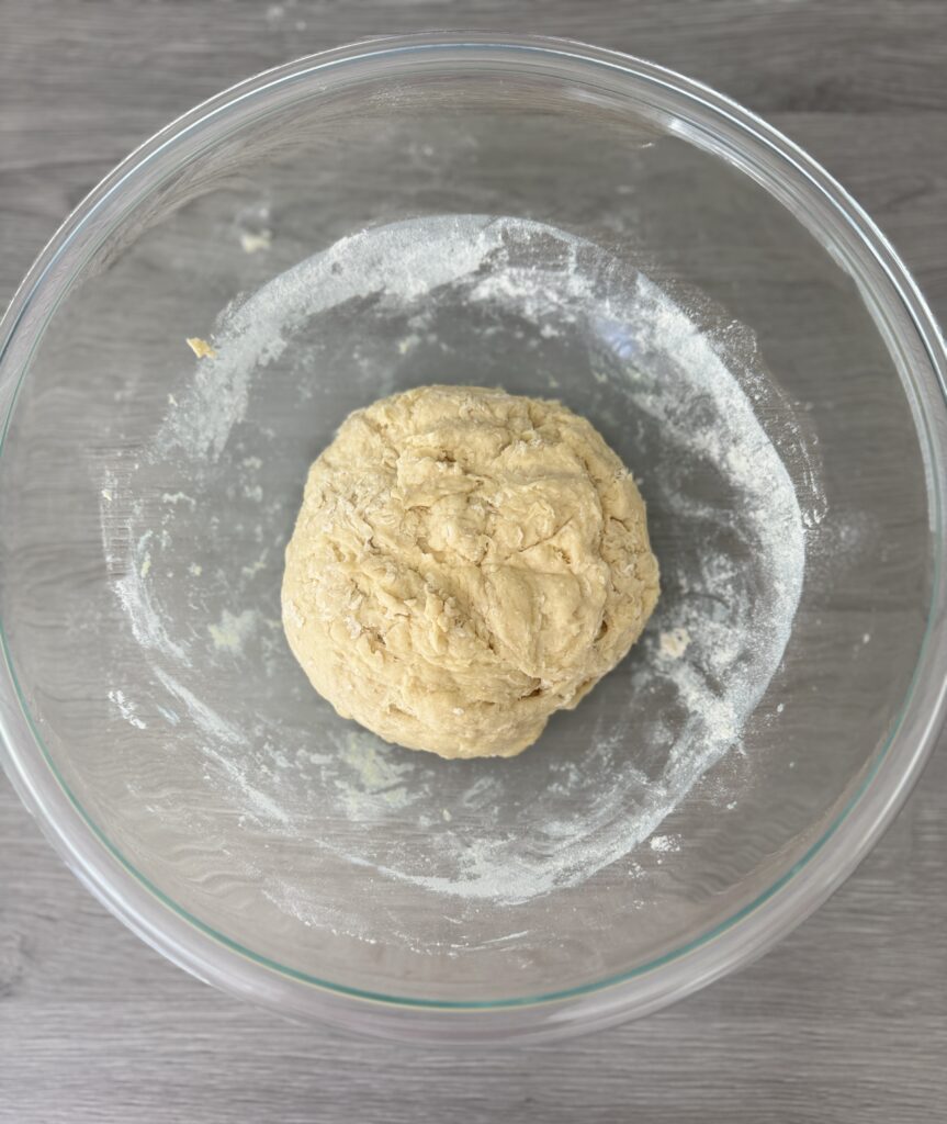 mixing sourdough discard cinnamon rolls dough