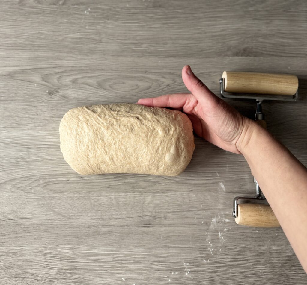 shaping honey wheat sourdough sandwich bread
