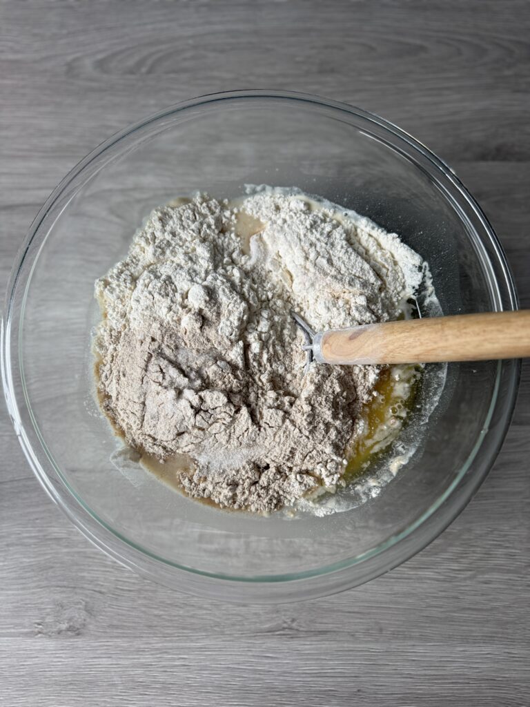 mixing honey wheat discard sandwich bread