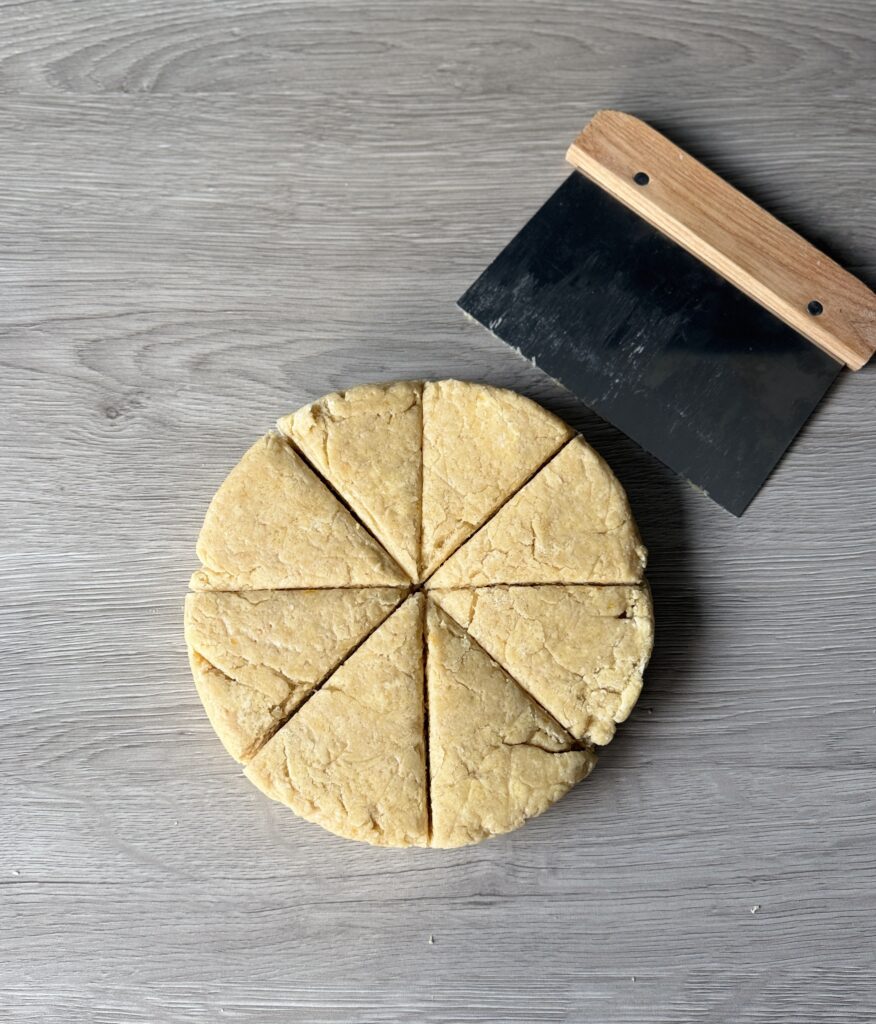 cutting vanilla orange scones