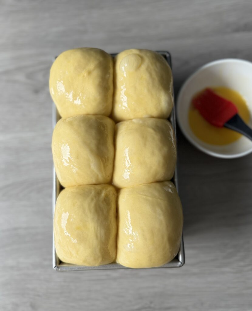 brushing sourdough brioche