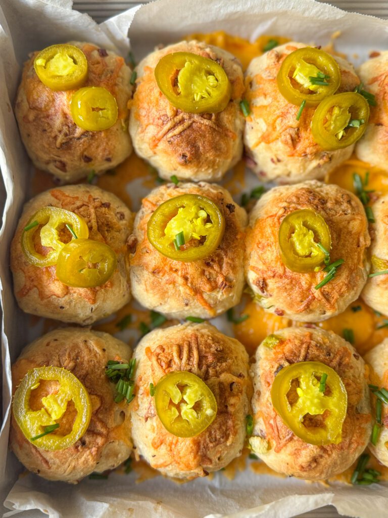 jalapeno cheddar bacon sourdough biscuit bombs in pan