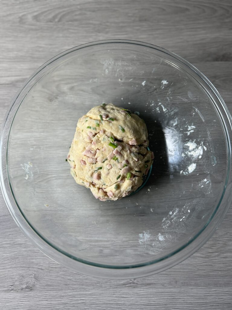 mixing ham and cheese biscuit bombs
