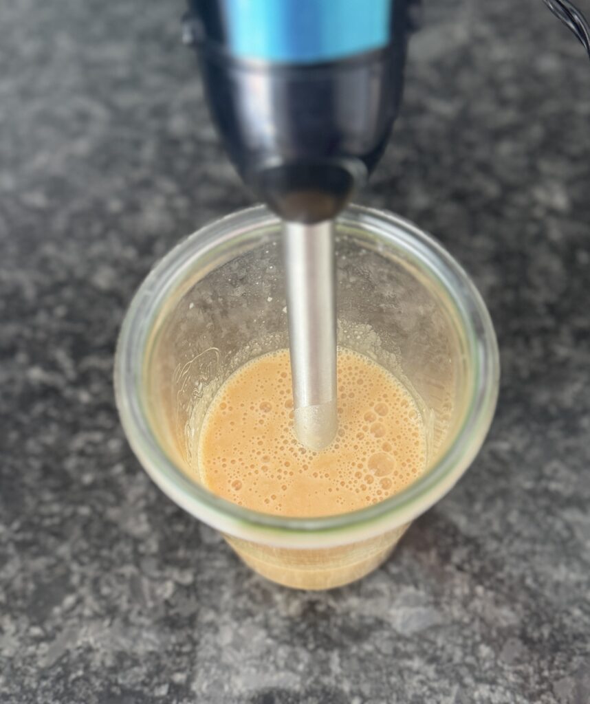 blending tomato white bean stew