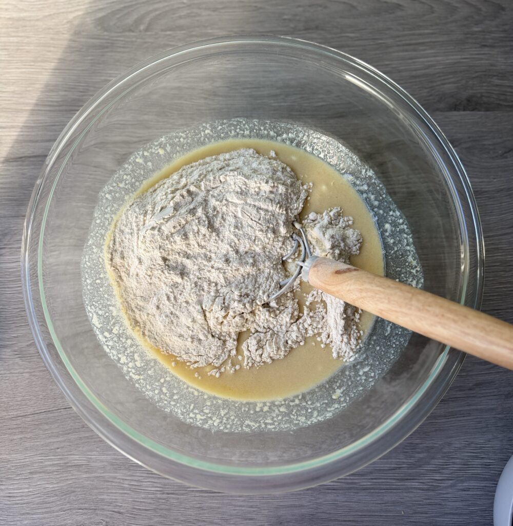mixing blueberry lemon donut muffins