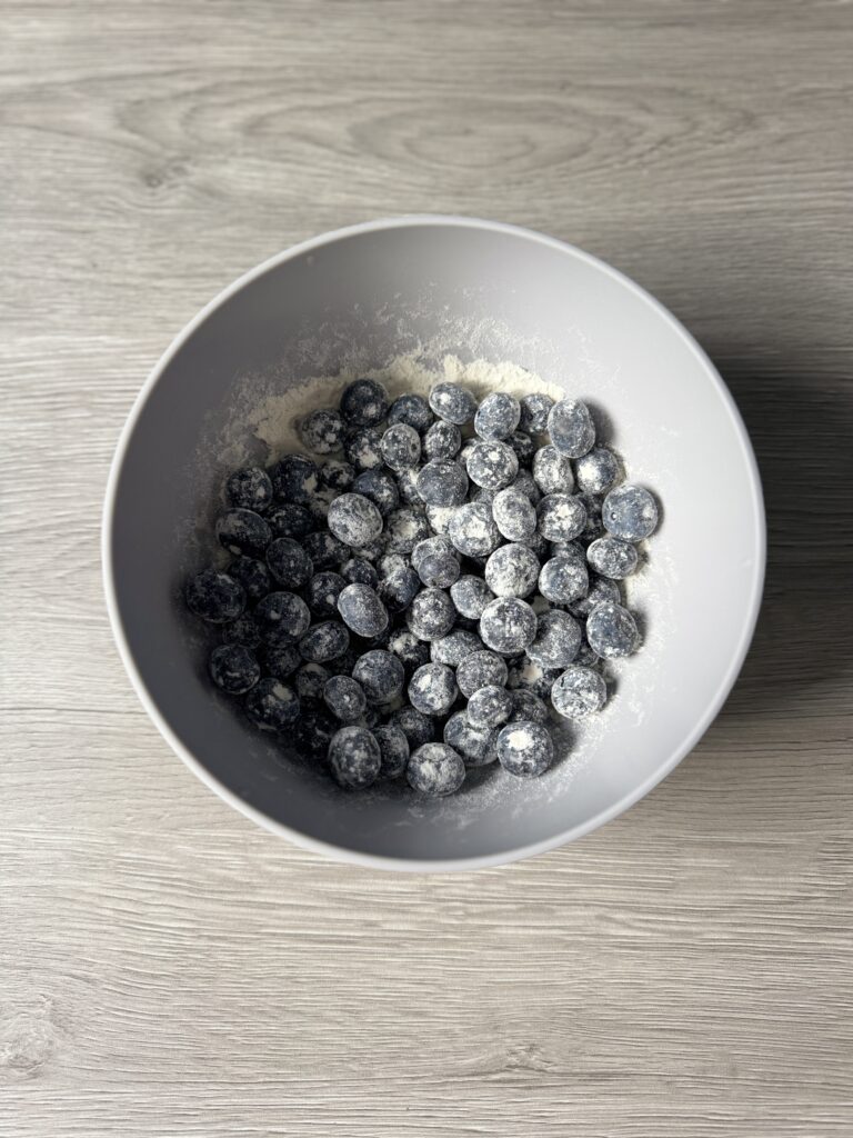 mixing blueberry lemon donut muffins