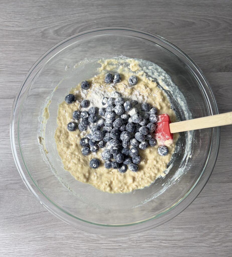 mixing blueberry lemon donut muffins