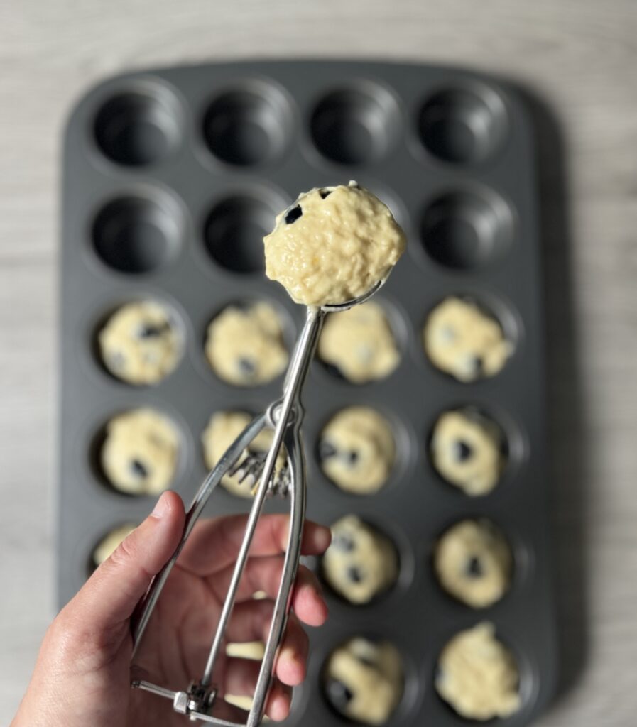 dividing blueberry lemon sourdough donut muffins