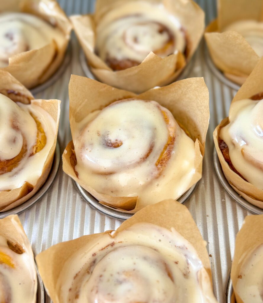 frosted pumpkin cinnamon roll muffins