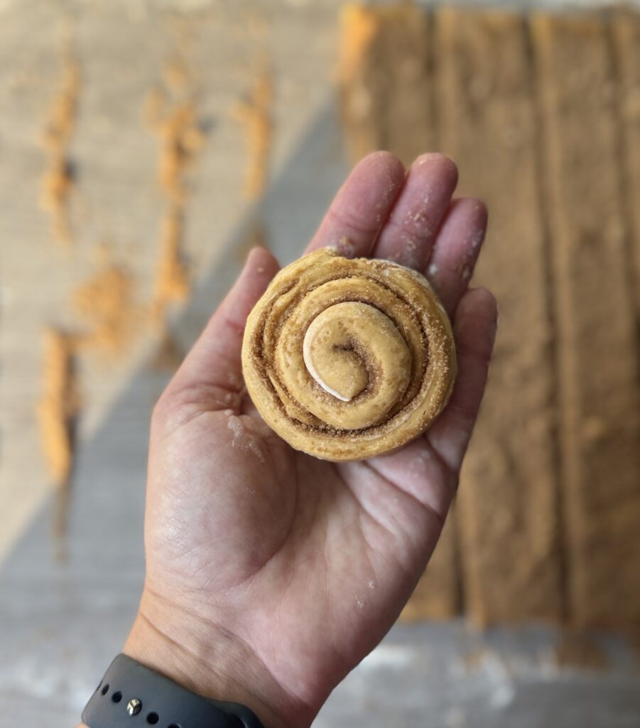 rolling pumpkin cinnamon roll muffins