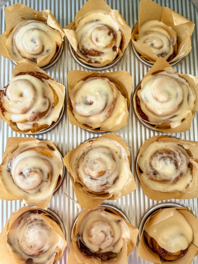 frosted pumpkin cinnamon roll muffins