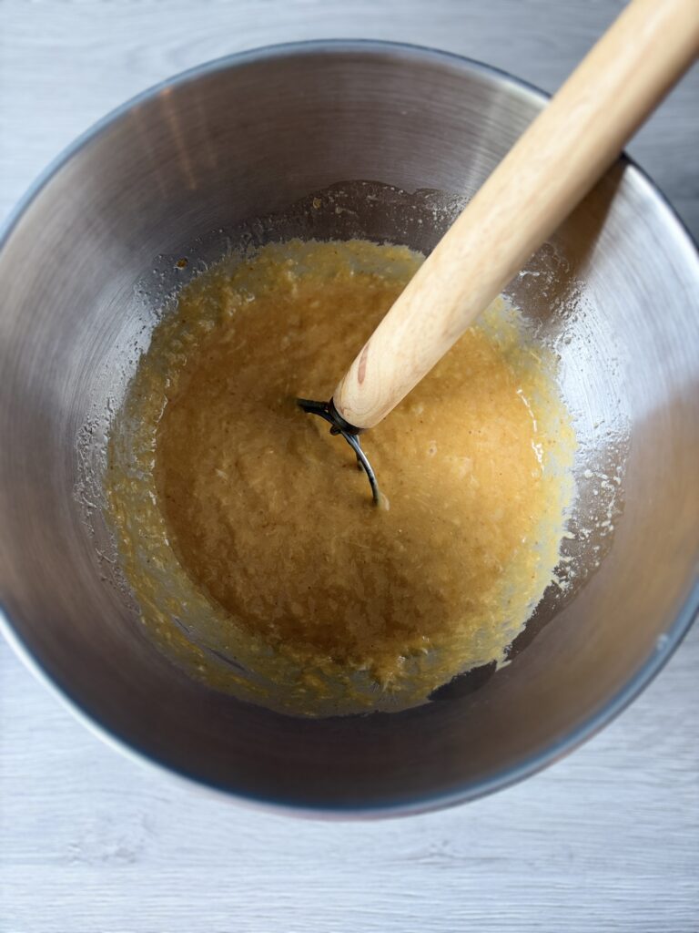 mixing pumpkin challah