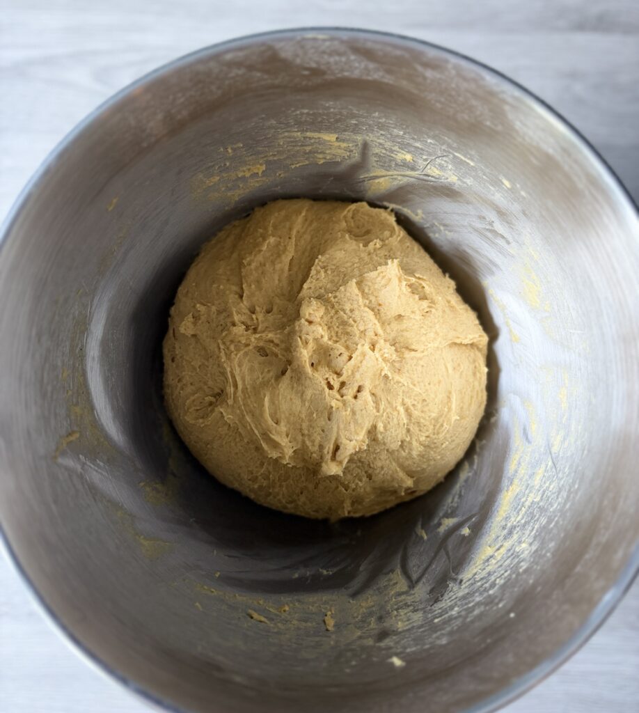 mixing pumpkin challah